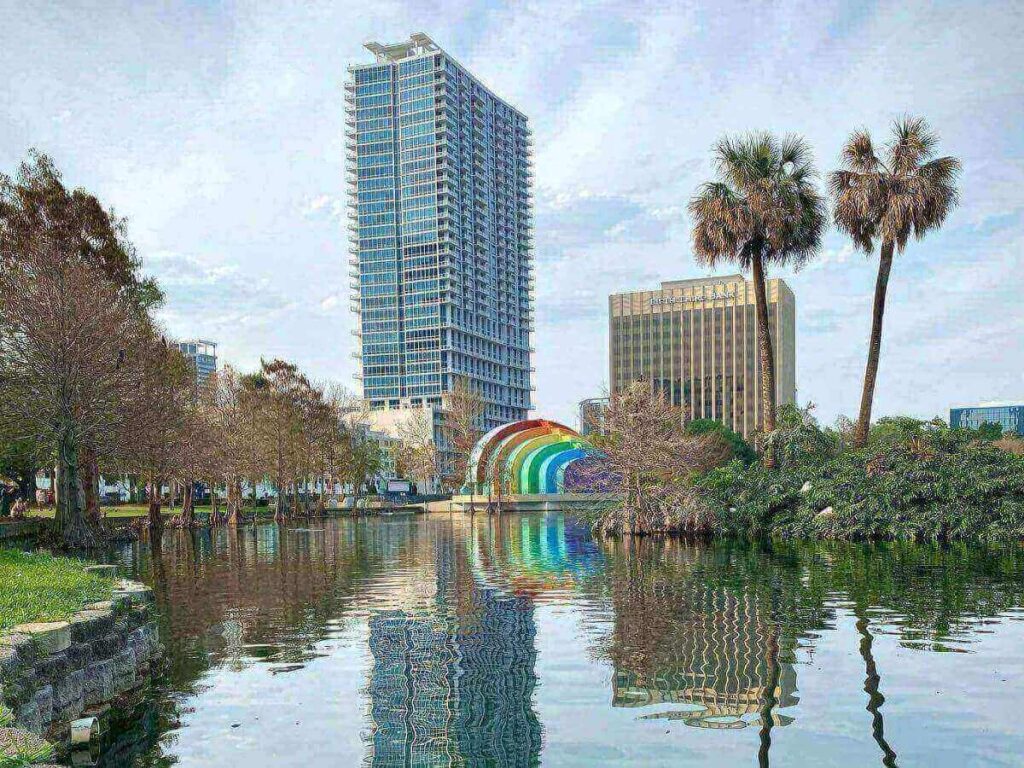 Quiet lake in Orlando surrounded by trees and low-rise neighborhoods
