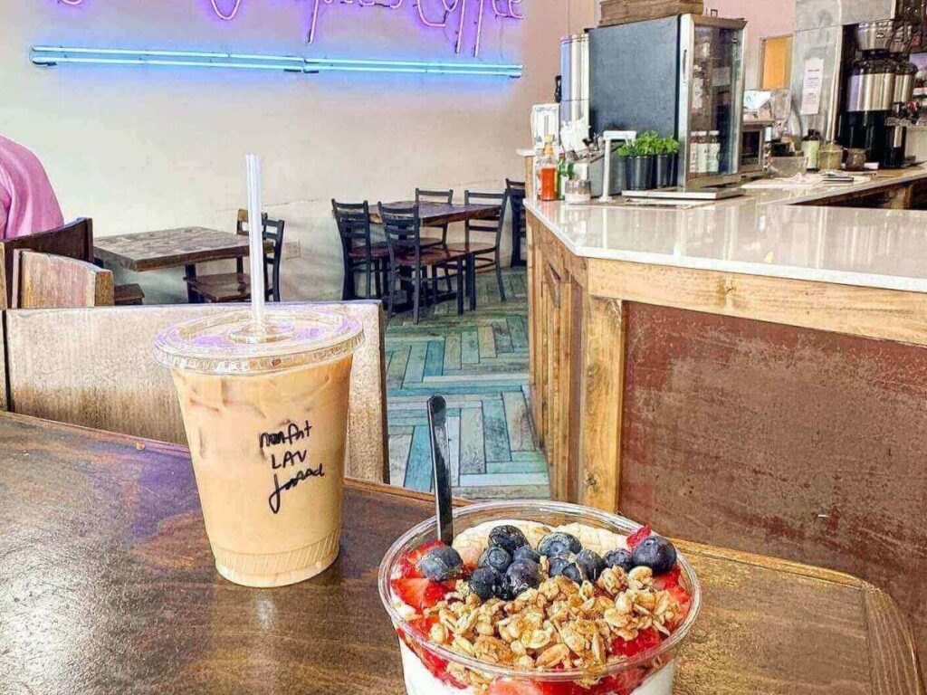 Interior of Publik Coffee Roasters with people sitting and relaxing