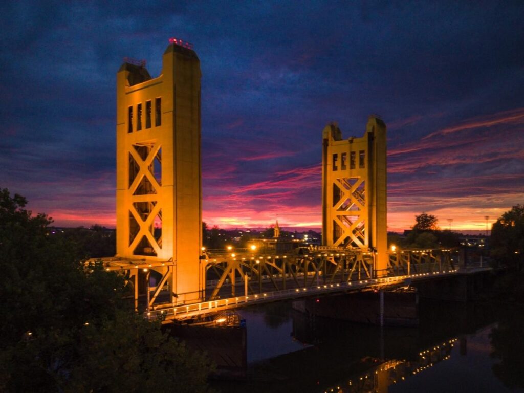 Golden Tower Bridge in Sacramento at sunset over the Sacramento River