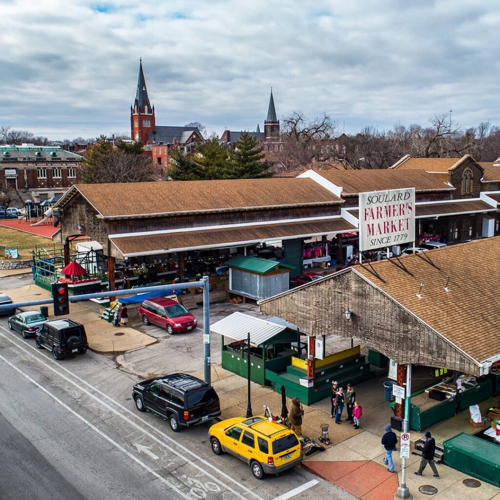 stalls at Soulard Farmers Market with people shopping