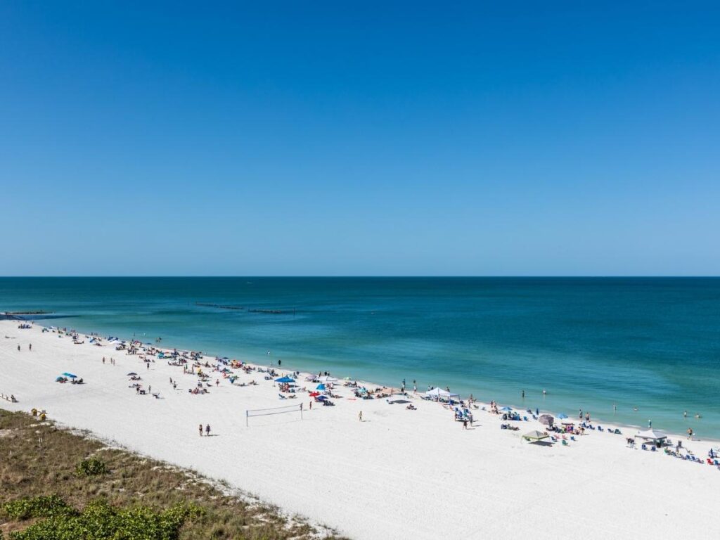 Early morning at South Marco Beach with quiet shoreline and calm Gulf water