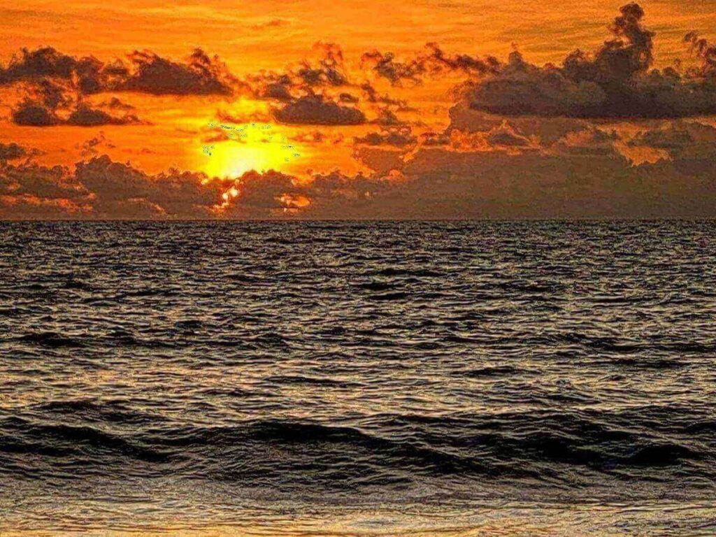 Sunset at South Marco Beach with soft colors reflecting over the Gulf