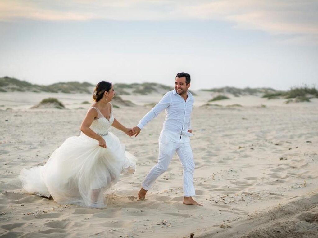Couple sitting on the beach in South Padre Island during sunset
