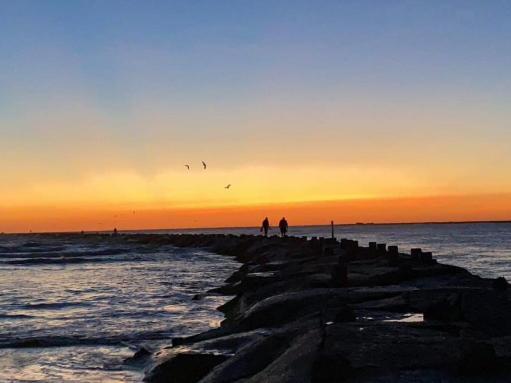 Evening beach walk in South Padre Island with waves and fading light