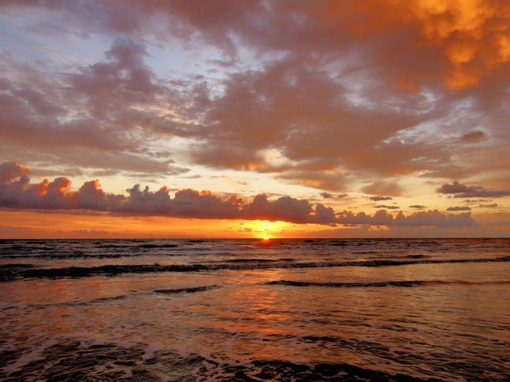 Sunset over the ocean in South Padre Island with a calm shoreline