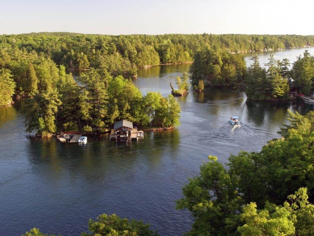 Boat moving slowly through the Ten Thousand Islands surrounded by mangroves