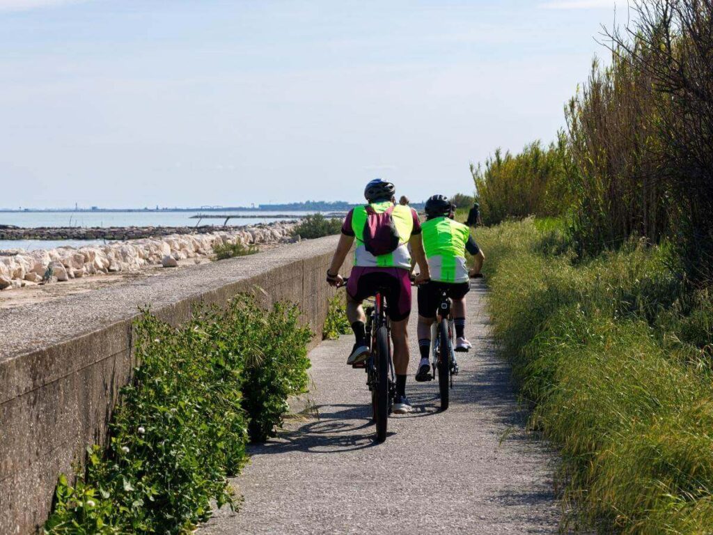 People biking near the dunes and beaches outside Provincetown on a sunny day