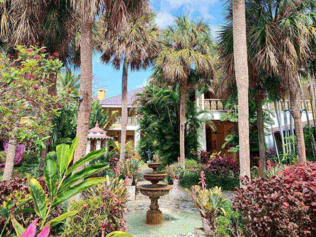 Bonnet House Museum and Gardens surrounded by tropical greenery