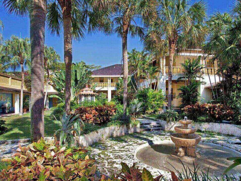 Bonnet House Museum and Gardens surrounded by tropical plants in Fort Lauderdale