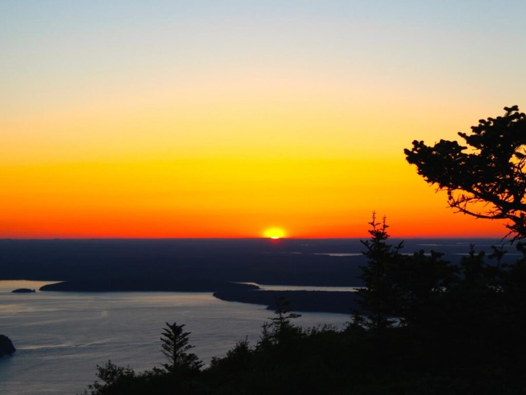 Sunrise light from Cadillac Mountain summit in Acadia