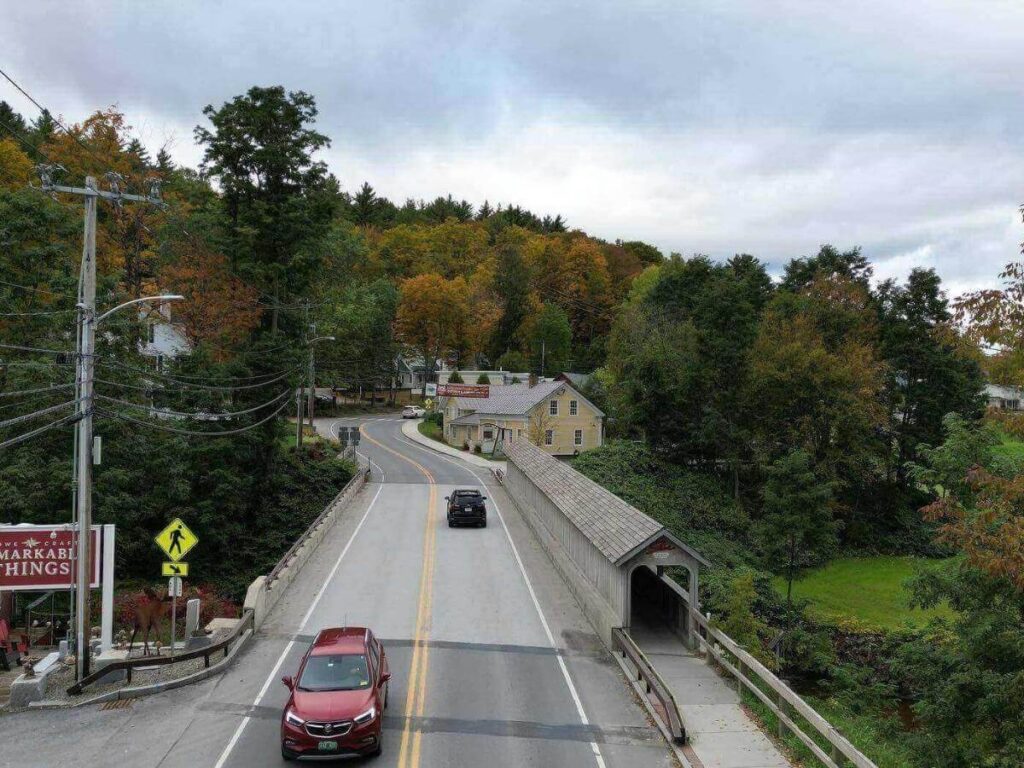 Covered bridge near Stowe, Vermont with water flowing underneath