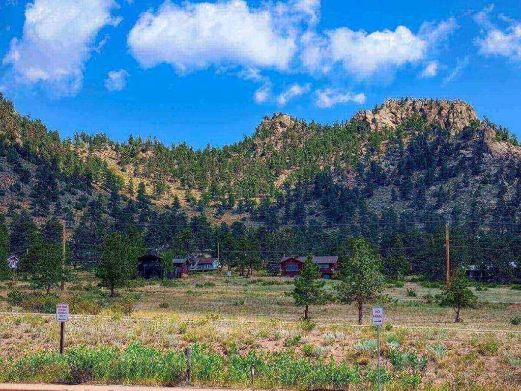 A scenic view of Estes Park town nestled in a mountain valley.