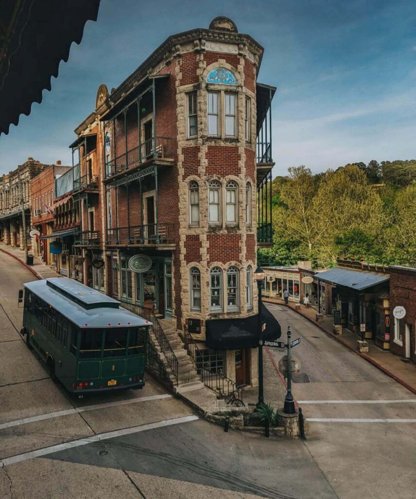 Historic downtown Eureka Springs Arkansas with Victorian buildings on hillside streets