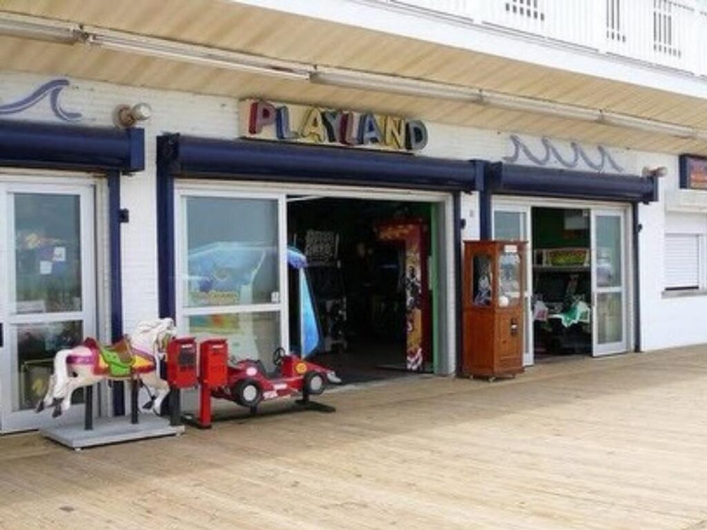 Funland amusement rides lit up at night on Rehoboth Beach boardwalk