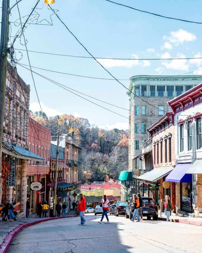 Historic downtown Eureka Springs Arkansas with colorful Victorian buildings and hillside streets