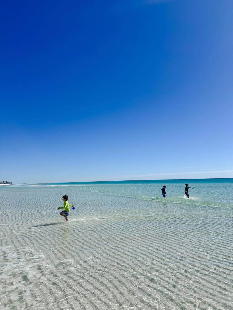 Families enjoying the beach at James Lee Park in Destin
