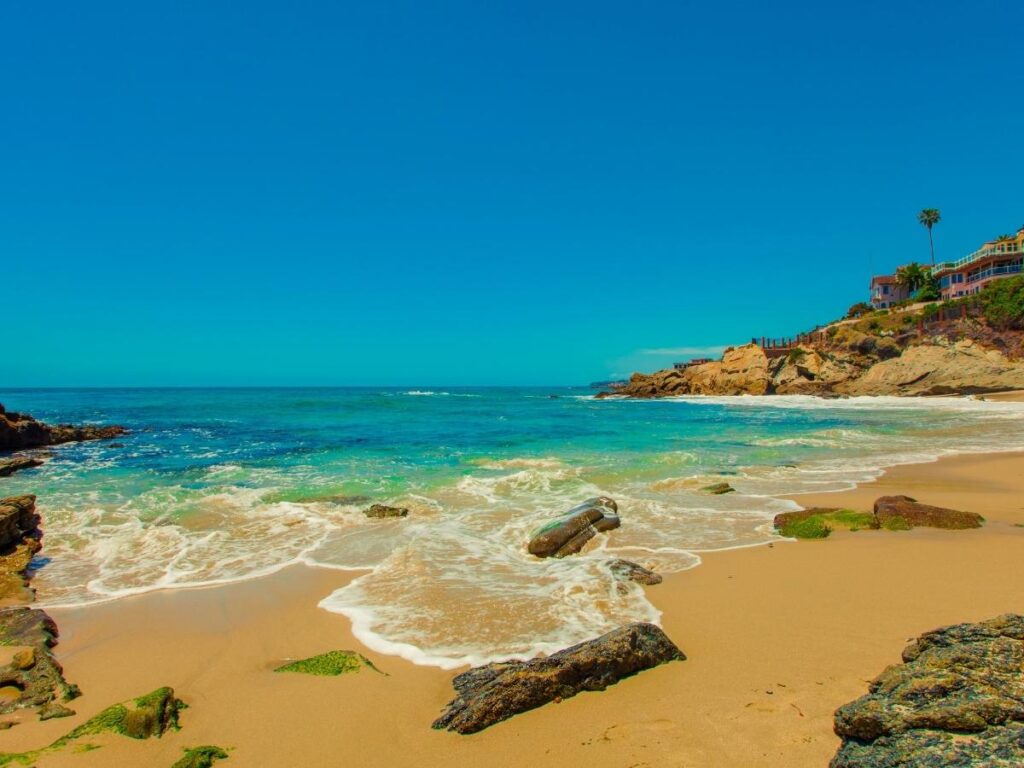 Quiet cove in Laguna Beach with gentle waves and cliffs