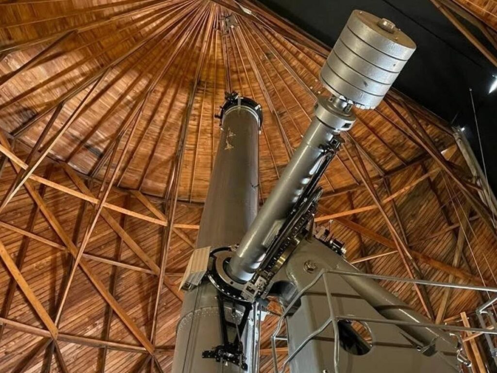 Night sky and telescope domes at Lowell Observatory in Flagstaff