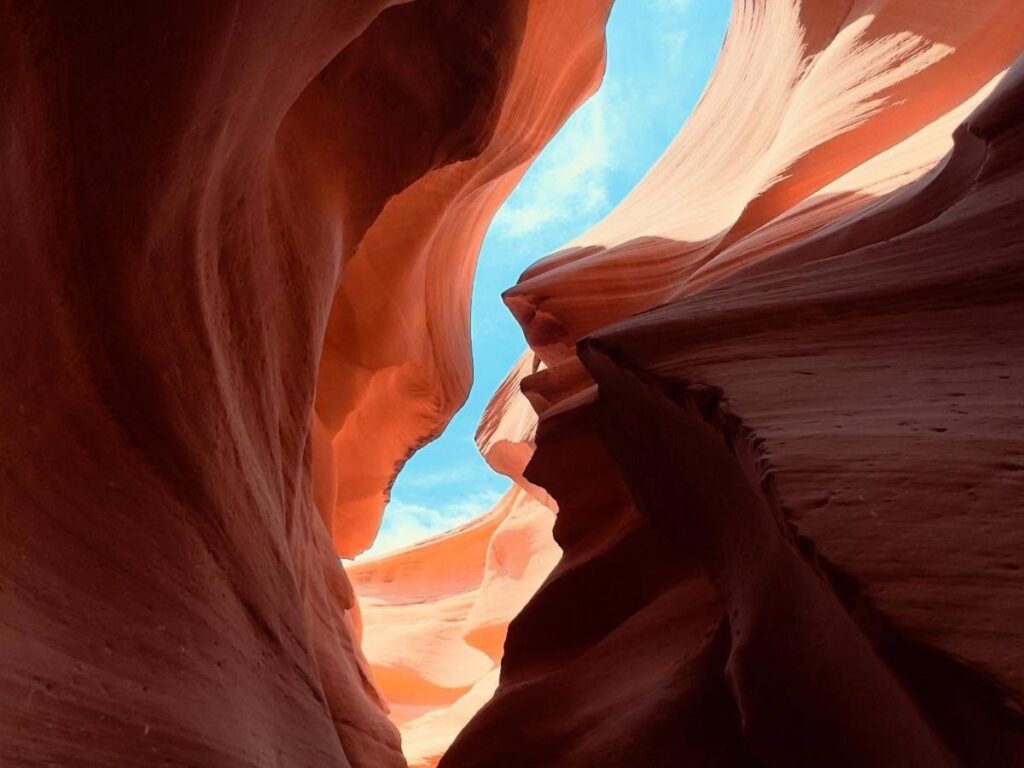 Narrow sandstone walls and ladders inside Lower Antelope Canyon