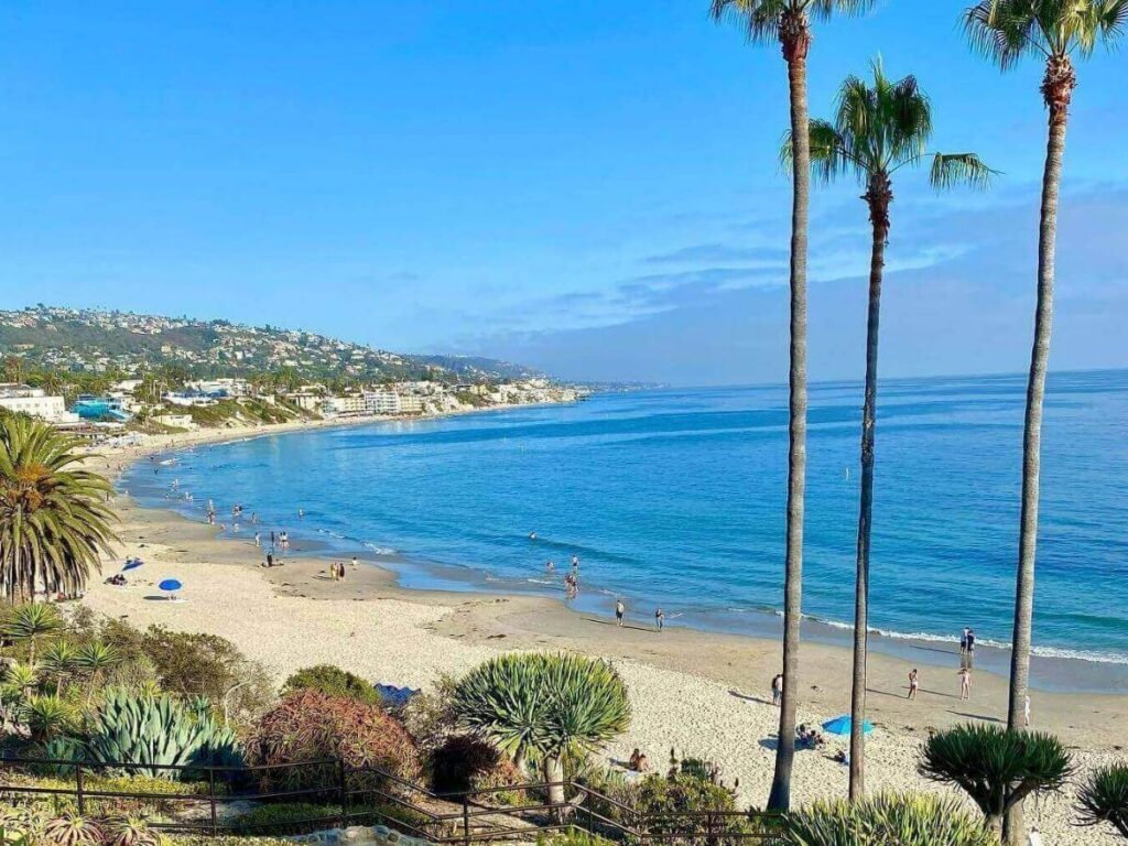Main Beach in Laguna Beach with surfers and open shoreline