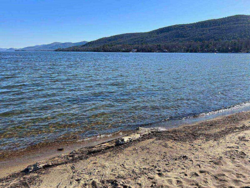 Million Dollar Beach in Lake George with swimmers and clear lake water