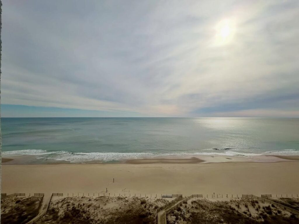 Aerial view of Ocean City Maryland showing the beach, boardwalk, and bay