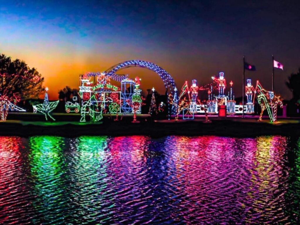 Ocean City Boardwalk at night with lights, rides, and people strolling