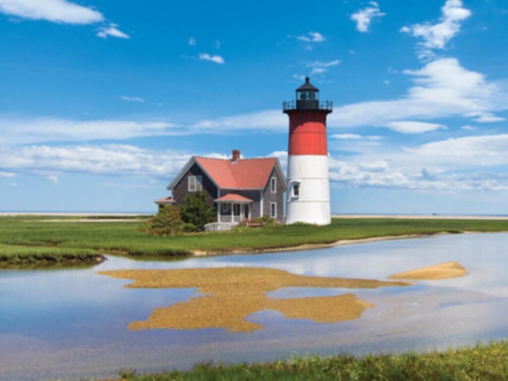 Aerial view of Provincetown at the tip of Cape Cod surrounded by water and dunes