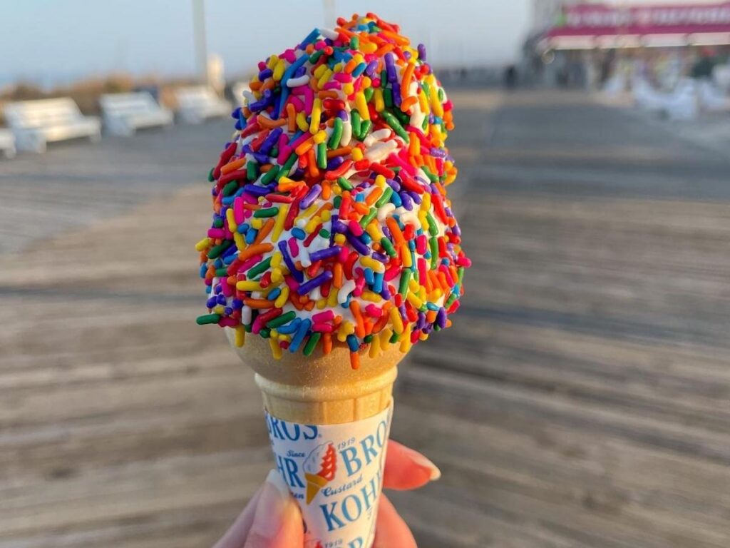 Walking the Rehoboth Beach boardwalk with ice cream in the evening