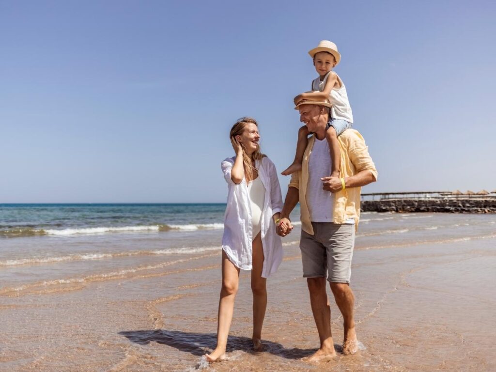 Families walking on the Rehoboth Beach boardwalk during summer