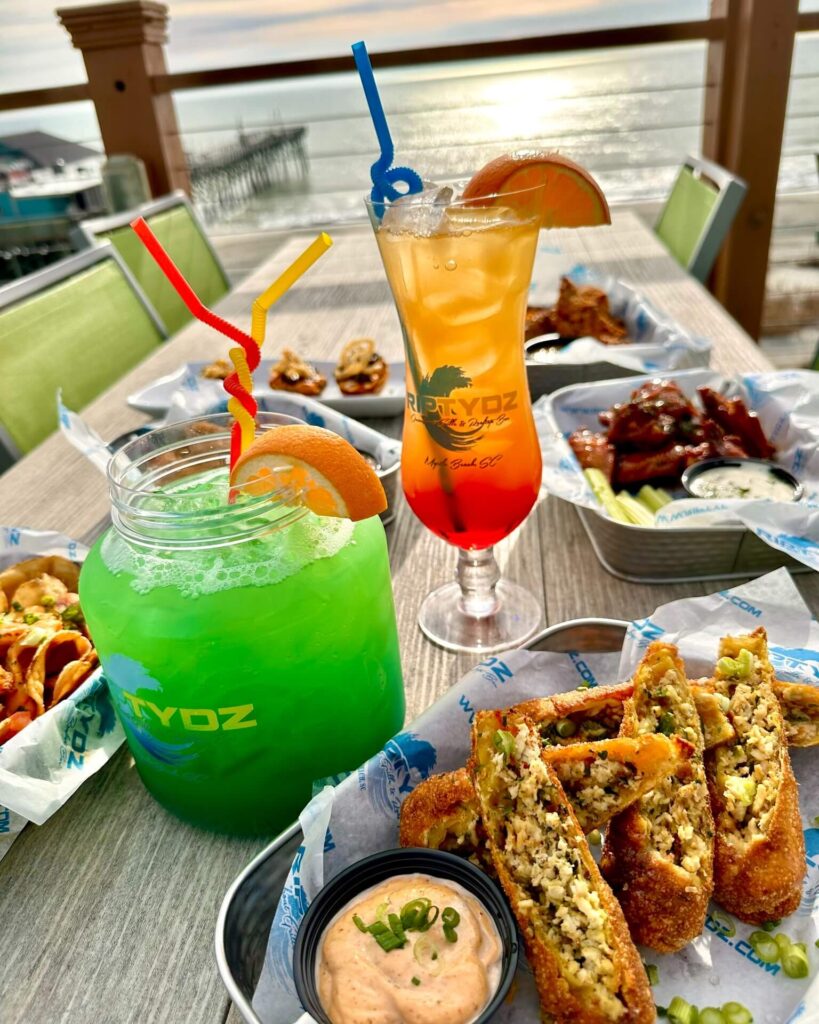 Tropical cocktail with ocean view at RipTydz rooftop