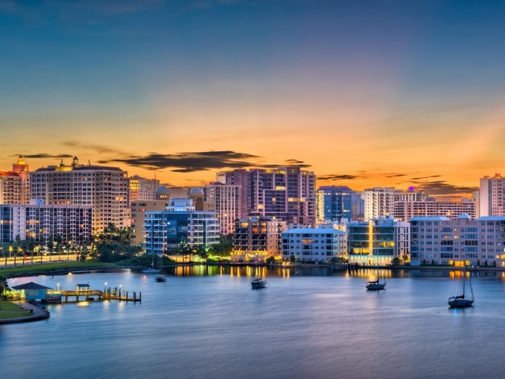 Peaceful sunset over water in Sarasota, Florida with soft light and calm surroundings