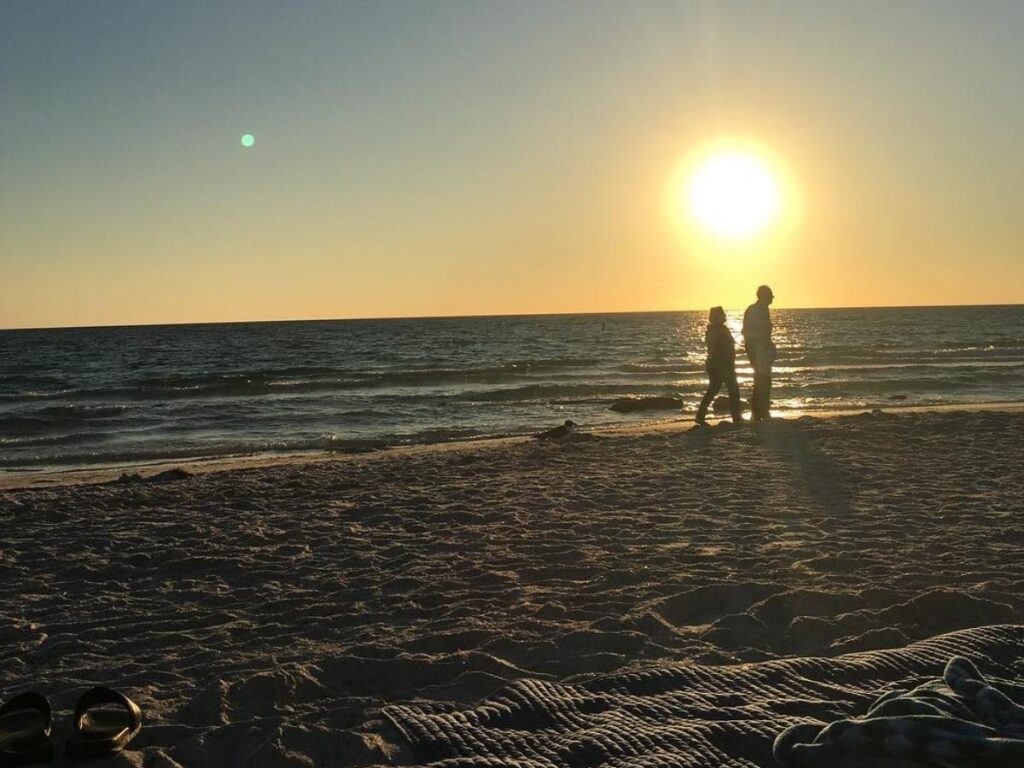 Warm spring day at a Sarasota beach with clear skies and light crowds
