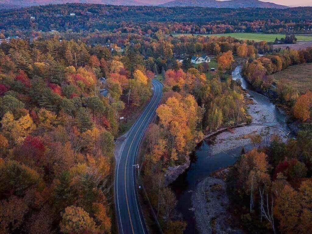 Scenic mountain road near Stowe, Vermont surrounded by trees