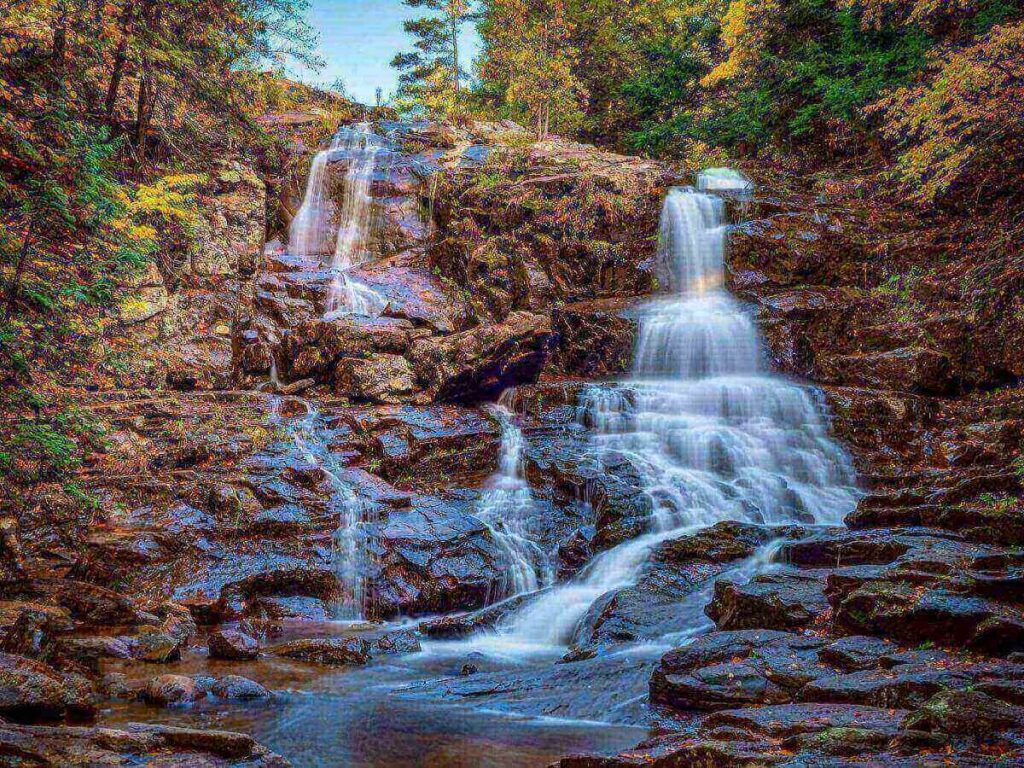Shelving Rock Falls near Lake George with water flowing over rocks and trees