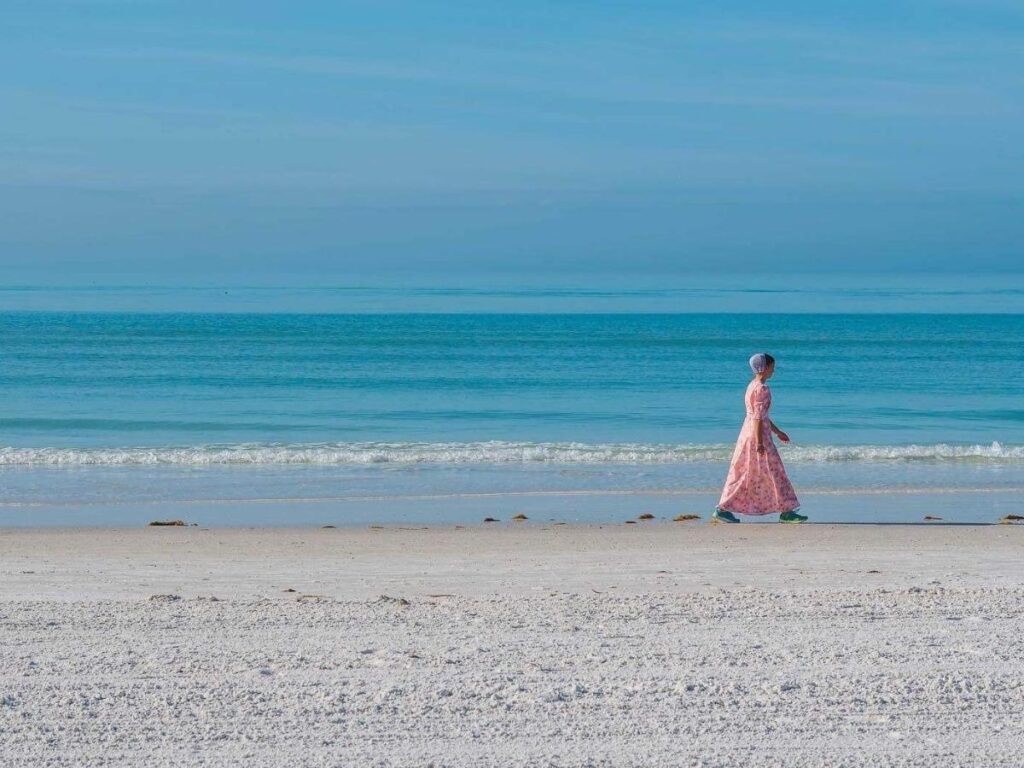 Quiet morning walk along Siesta Key Beach in Sarasota with soft sand and calm water