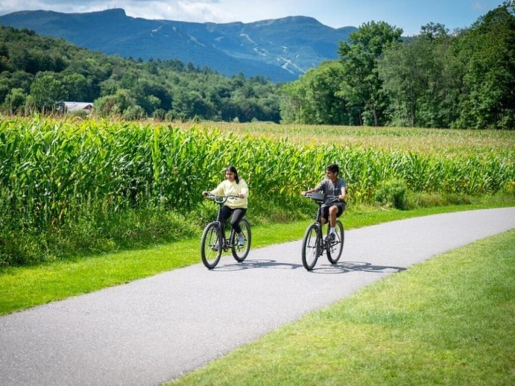 Walking along the Stowe Recreation Path surrounded by trees and open fields