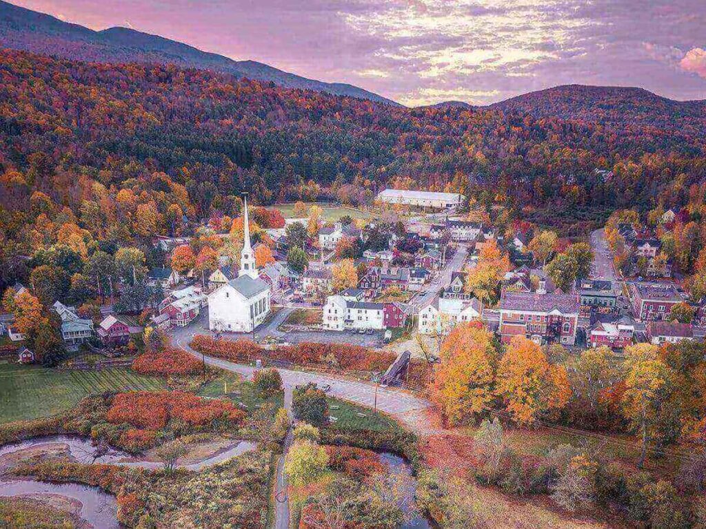 Walking through downtown Stowe with small shops and mountain views