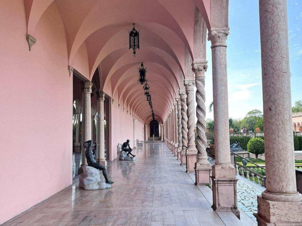 Exterior view of The Ringling art museum with columns and palm trees