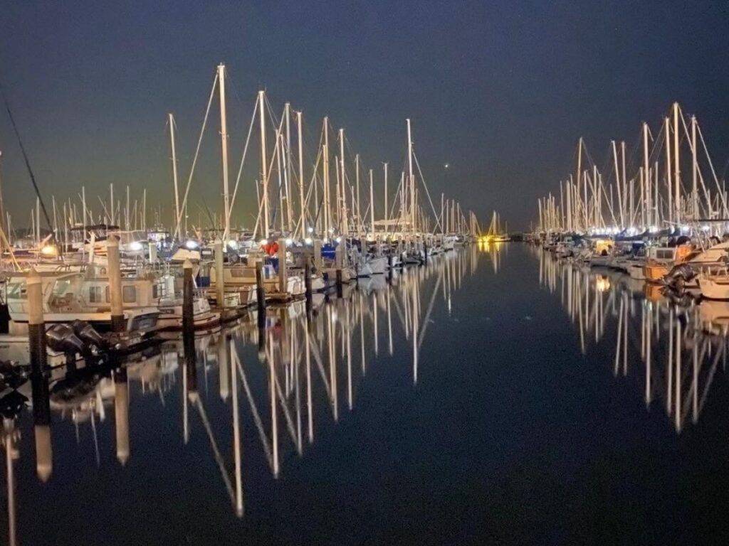 West Beach in Santa Barbara near the harbor with calm water and boats
