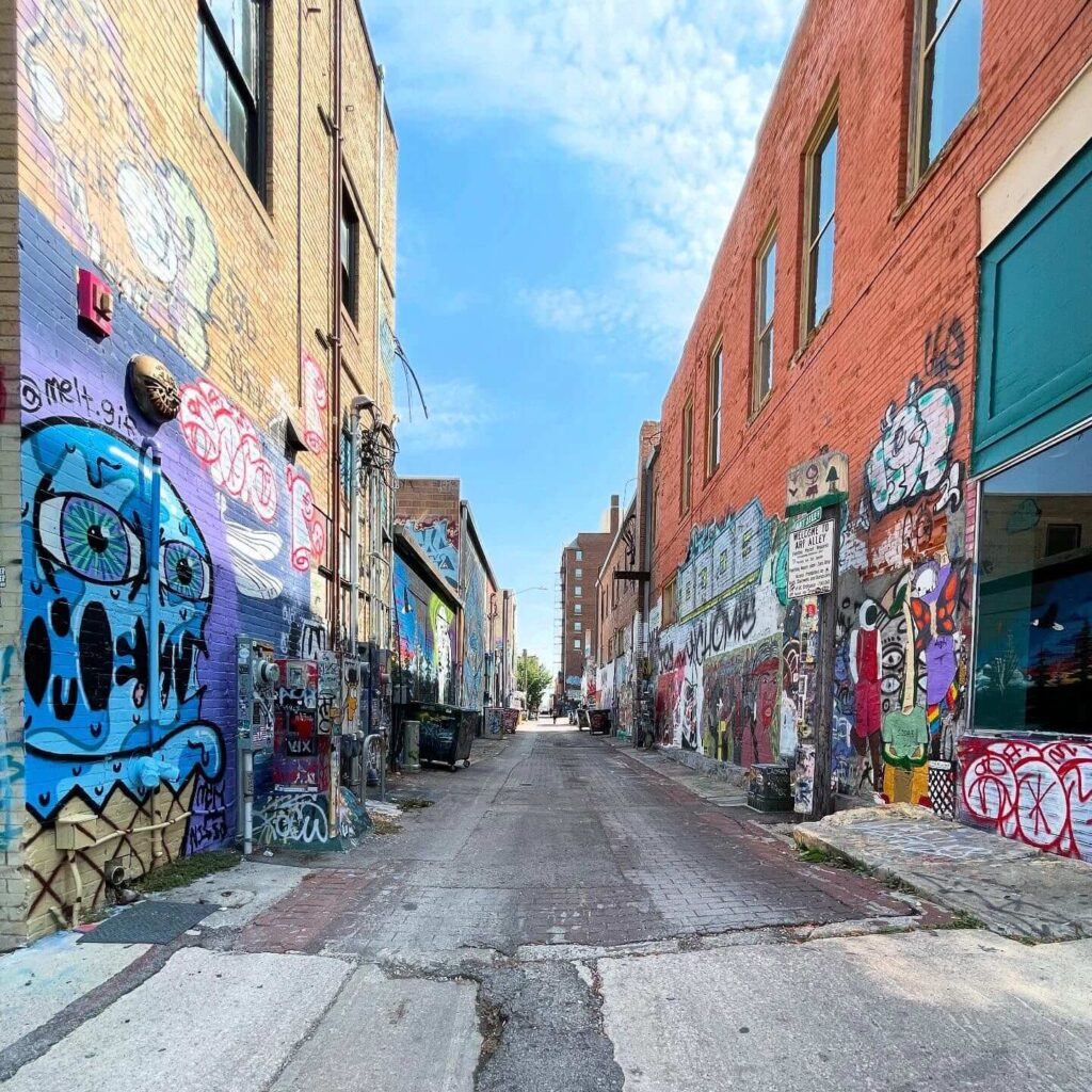 Colorful graffiti murals covering walls in Art Alley, Downtown Rapid City