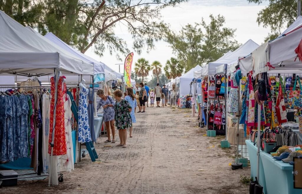Artisanal stalls with handmade jewelry and tropical crafts at Coquina Beach Market