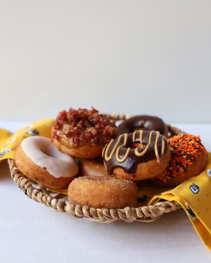 Custom donuts with colorful toppings at The Donut Experiment