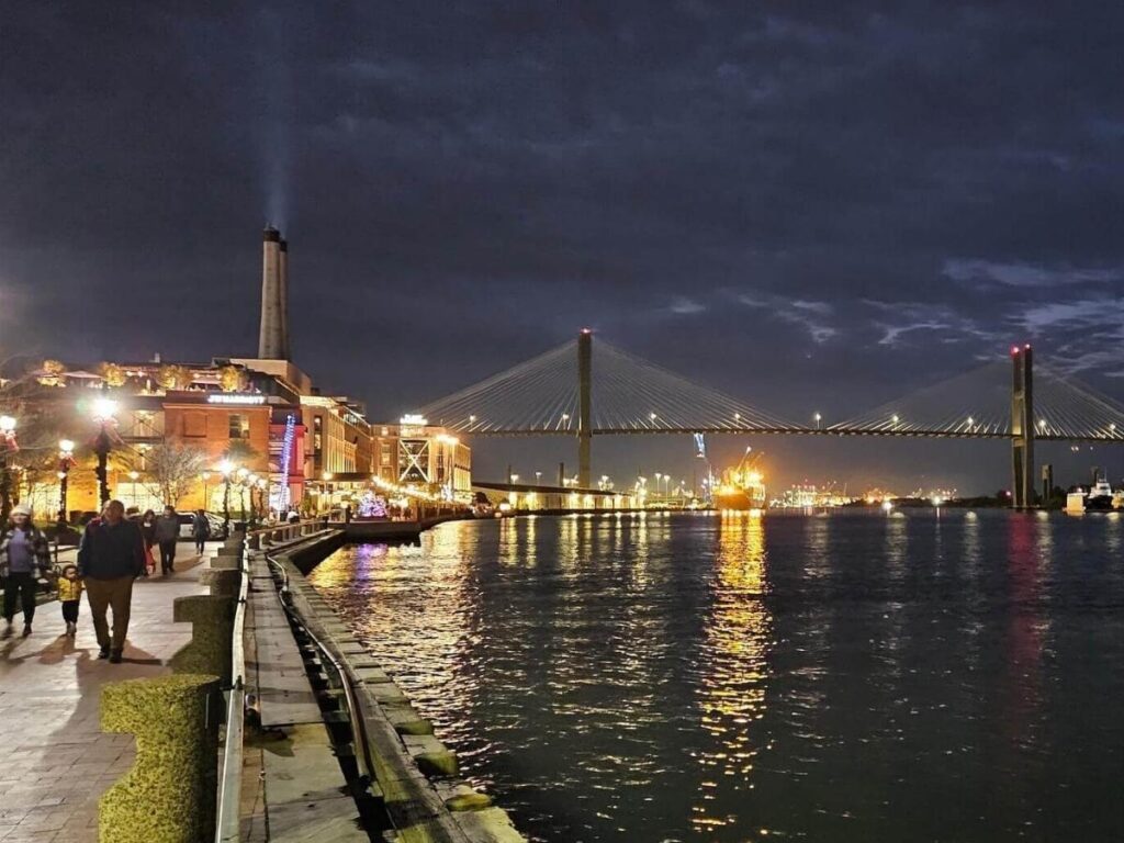 River Street in Savannah during the evening with people walking along the waterfront