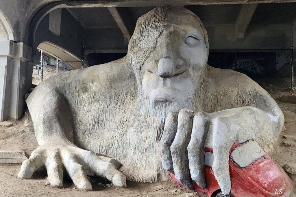 Fremont Troll sculpture holding a Volkswagen under the bridge