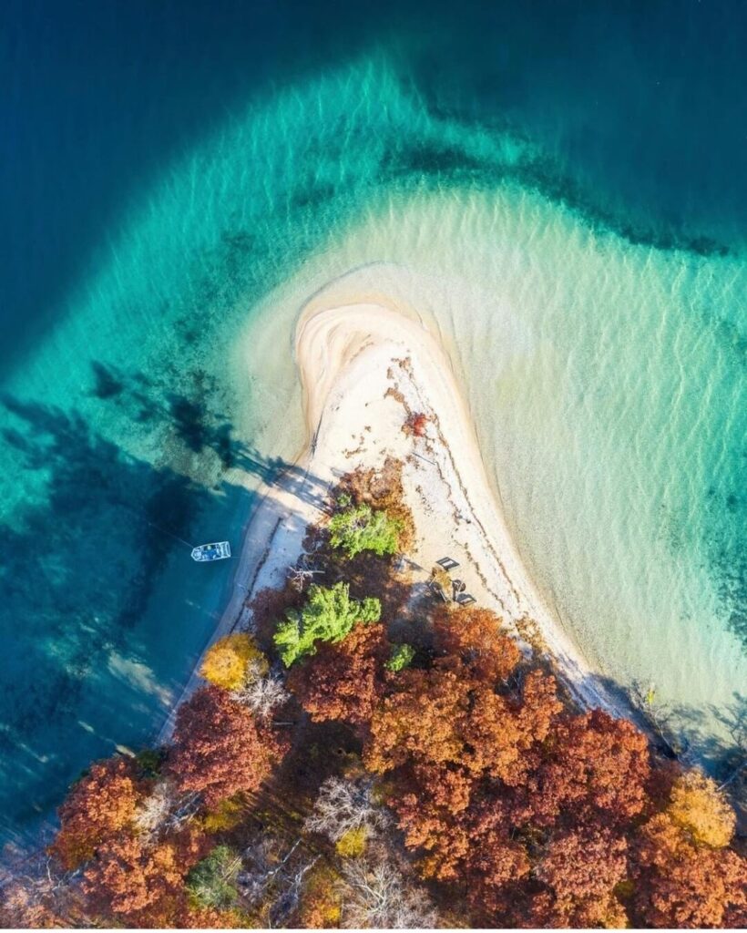 Aerial view of the crystal-clear waters of Grand Traverse Bay