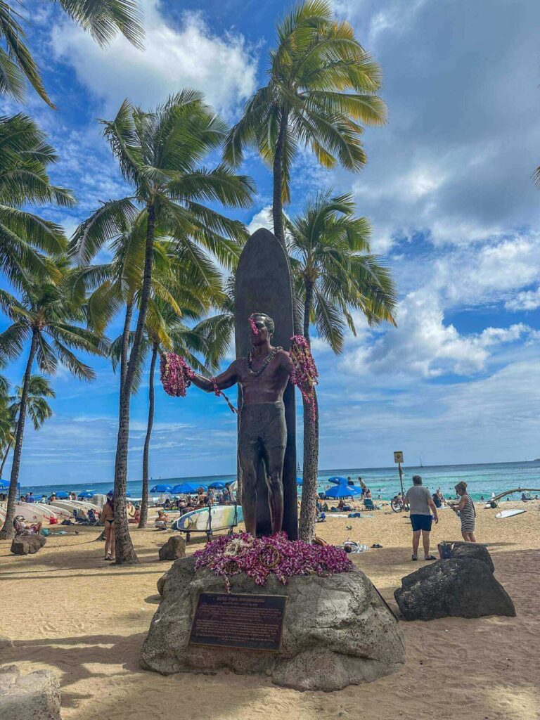 Traveler walking through Waikiki with a daypack during a one-day Honolulu itinerary
