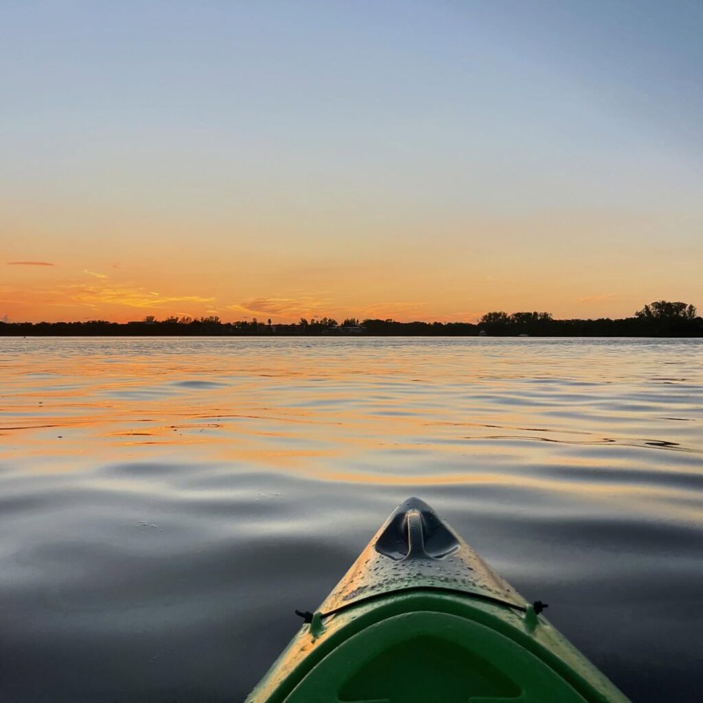 Kayaker gliding through water