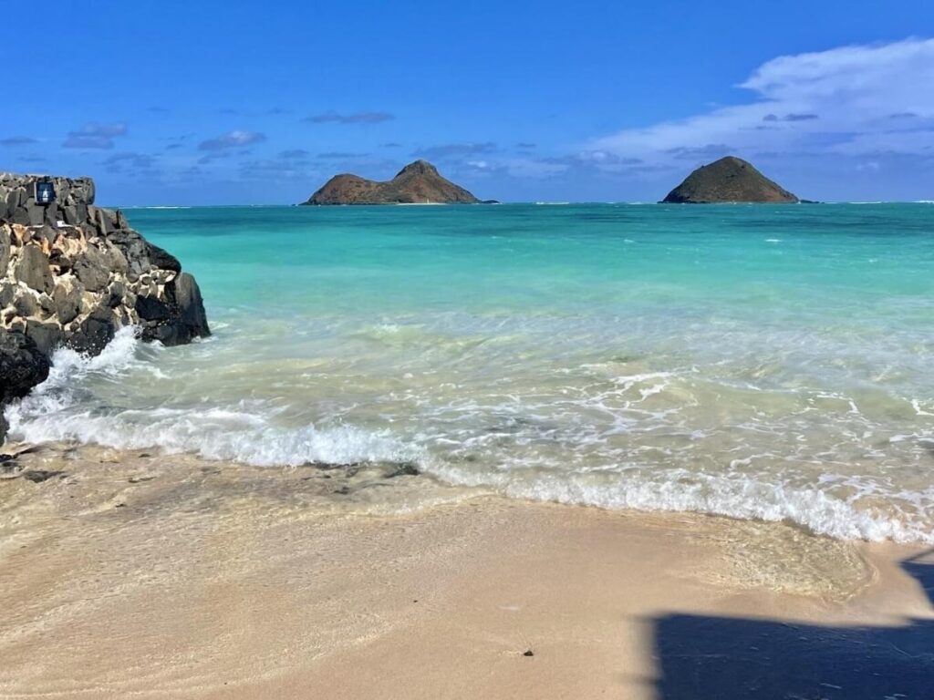Lanikai Beach with turquoise water and the Mokulua Islands offshore