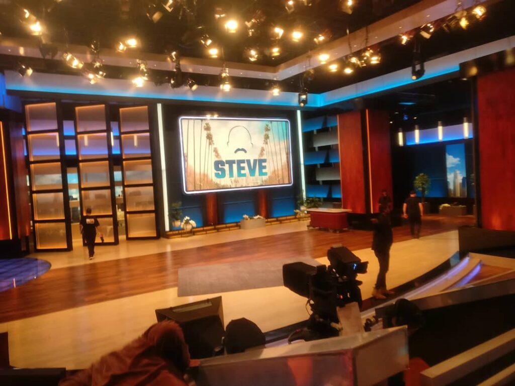 Audience watching a live TV sitcom taping inside a Los Angeles studio